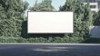 © Koplexs-Stock - Blank Billboard in a City Park with Green Foliage