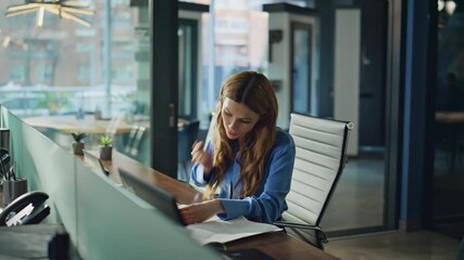 Poster - Professional woman organizing papers at workplace. Focused female employee 