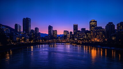 Wall Mural - a view of a city at night from across the river