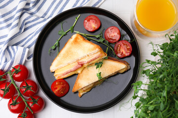 Wall Mural - Pieces of toasted bread with melted cheese, ham, tomatoes and juice on white table, top view