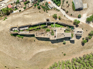 Sticker - Aerial view of Huerta de la Obispalia in La Mancha Spain, hilltop medieval fortification with pentagonal bastion gun platforms at both ends