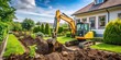 © Vibrant Visions Pixe - Mini excavator digging and preparing the ground under a home garden , mini excavator, digging, preparing, ground
