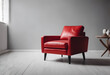 © Tetlak - A stylish red armchair with a unique design, featuring a back and winged sides, placed against a plain wall.