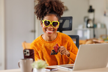 African American woman in sunglasses lady girl afro hair holding money and credit card, shopping payment concept.