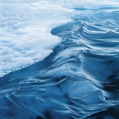 Canvas Print - Melting ice on a blue water surface.