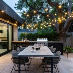 Wall Mural - Modern outdoor dining area with string lights and a grill.