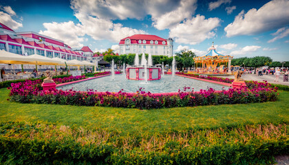 Wall Mural - Colorful summer view of blooming flowers, fountain and modern buildings in Dolny Sopot resort. Superb morning scene of outskirts of popular tourist destination - Sopot Pier (Molo in Sopot), Poland.