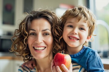 Smiling mother holding apple with son, Generative AI