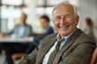 © Media Masterpieces - Smiling mature businessman sitting with colleagues in an office, Generative AI