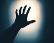© Tonton54 - A shadowy hand reaching out against a soft light background, symbolizing longing, desire, or a call for help.