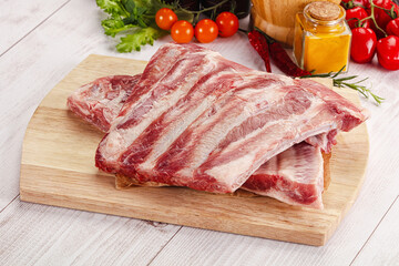 Wall Mural - Raw pork ribs over board