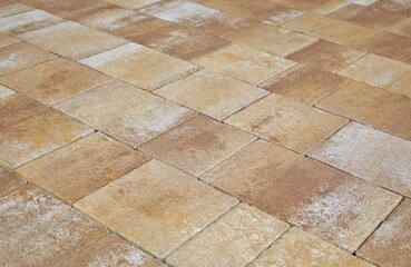 Wall Mural - Brown, beige and gray concrete paver stones of different shapes. Stone effect for outdoor flooring, backyard or sidewalk. Background and texture.