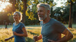 © big_and_serious - A senior man running alongside a younger woman in a beautiful park surrounded by trees and sunlight