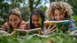 © Piyawat - Teenagers using e-readers in a park, modern literacy