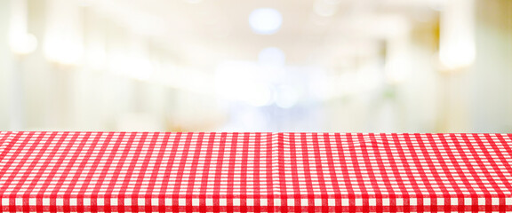 Wall Mural - Food background, Empty table with red check table cloth over blurred cafe background, for product display montage banner, template, wallpaper