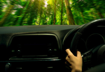 Wall Mural - Driving through lush green forest in electric vehicle. Green transportation, net zero emissions, and carbon reduction concept. Future of eco-friendly mobility and green technology. Sustainable future.