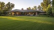 © Matcha_09 - Expansive lawn next to a one-story ranch-style house with a wraparound porch