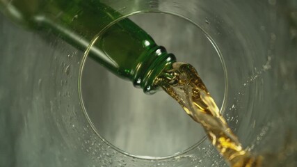 Wall Mural - Super Slow Motion of Macro Shot of Pouring Beer drink. Unique Perspective from inside of a Glass. Filmed on High Speed Cinema Camera, 1000 fps. Speed Ramp Effect.