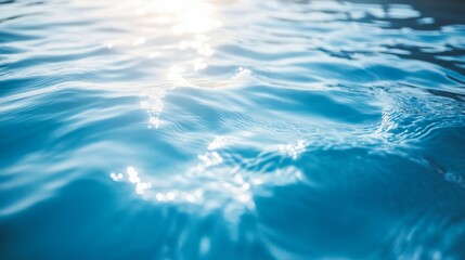 Gentle waves and ripples on a blue swimming pool surface, illustrating a tranquil and cooling effect.