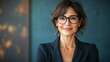 © Natali - Successful hispanic senior business woman standing confident proudly smiling aside. European Latin 40s years mature good looking middle age leader female businesswoman in office