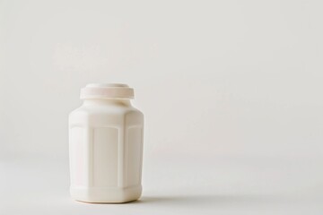 Poster - A bottle of milk placed on a clean white surface