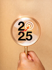 Poster - happy new year 2025 with business goal trends concept. 2025 calendar number with target icon hit by 