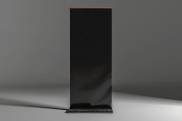 Poster - A tall black speaker standing on a white surface