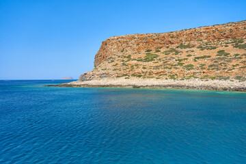 Wall Mural - Breathtaking landscape of coast of Mediterranean sea with mountains - Crete, Greece.
Beautiful, clear, blue sky and water. View from a ship on a cruise.