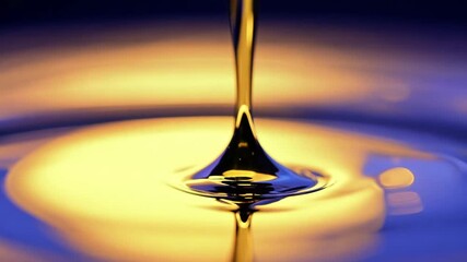 Poster - Close-up shot of a golden liquid drop creating ripples with a symbolic representation of interconnectivity