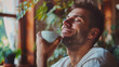© KotBaton - Photo of mature man smelling coffee, enjoying break at home or office.