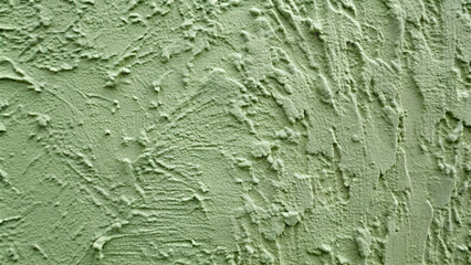 Poster - Close-up of a wall with paint. picturesque relief texture of dense clay. impasto, sage green