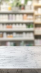 Wall Mural - Blurred pharmacy shelves with medication bottles and packages in background, white marble counter in foreground, creating professional healthcare ambiance.