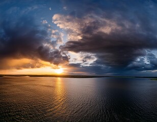 Wall Mural - gorgeous panorama view of the dark overcast sky. dramatic vibrant morning scene at sunrise .