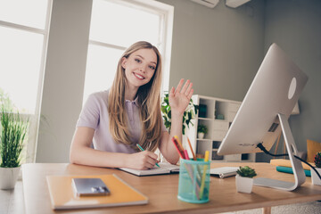 Wall Mural - Photo of shiny cute girl dressed purple t-shirt waving arm hi write diary remote education modern gadget indoors house apartment room