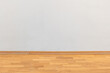 © Tomasz - Clean blank empty white grey wall modern contemporary interior indoors design low angle shot, background texture, copy space, nobody, wooden floor panels. Corporate office, museum, waiting room detail