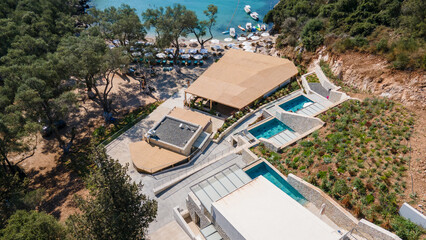 Wall Mural - Drone view of a beautiful tropical bar with swimming pools on a wonderful beach, lagoon.