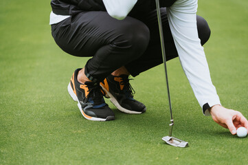 golfer putting a ball