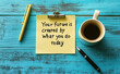 © vitanovski - Inspirational quote on a sticky note with coffee on a wooden table