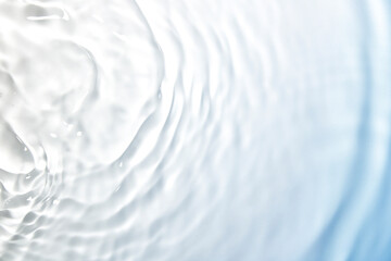 Wall Mural - the clear blue surface of the water gradients from light to dark.