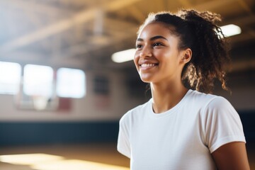 Wall Mural - Portrait of a smiling teenage female African American basketball player