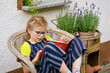 © Irina Schmidt - Little girl with eyeglasses reading book. Happy interested child learning.