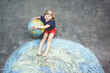 © Irina Schmidt - Little preschool girl with earth globe painting with colorful chalks on ground. Positive toddler child. Happy earth day concept. Creation of children for saving world, environment and ecology.