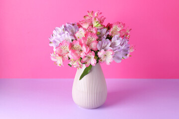 Wall Mural - Beautiful alstroemeria flowers in vase on color background