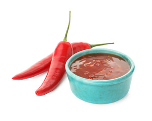 Wall Mural - Hot chili sauce in bowl and peppers isolated on white