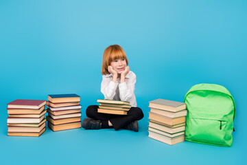 Full size photo of small schoolkid boy book bag look empty space wear uniform isolated on blue color background