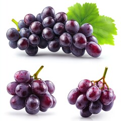 Wall Mural - Three bunches of fresh, ripe red grapes isolated on a white background, with one bunch featuring a green leaf.