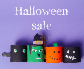 Wall Mural - Halloween sale with four paper cutouts of Halloween characters