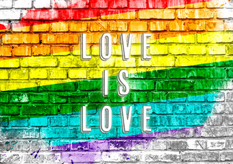 Poster - A colorful rainbow with the words love is written on it