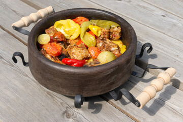 Traditional Balkan dish. Sac. baked meat with vegetables