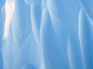 Wall Mural - snow texture. wind sculpted patterns on snow surface. wind in the tundra and in the mountains on the